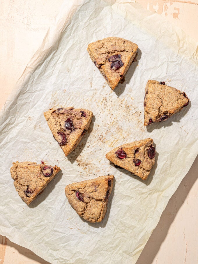 cherry scone wedges on parchment paper